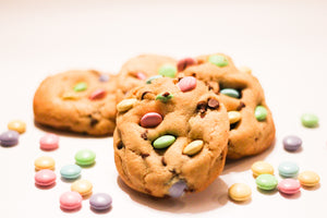 M&M cookies with pastel green, yellow, pink and purple M&Ms