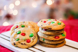 M&M cookies with red and green M&Ms sitting in a stack